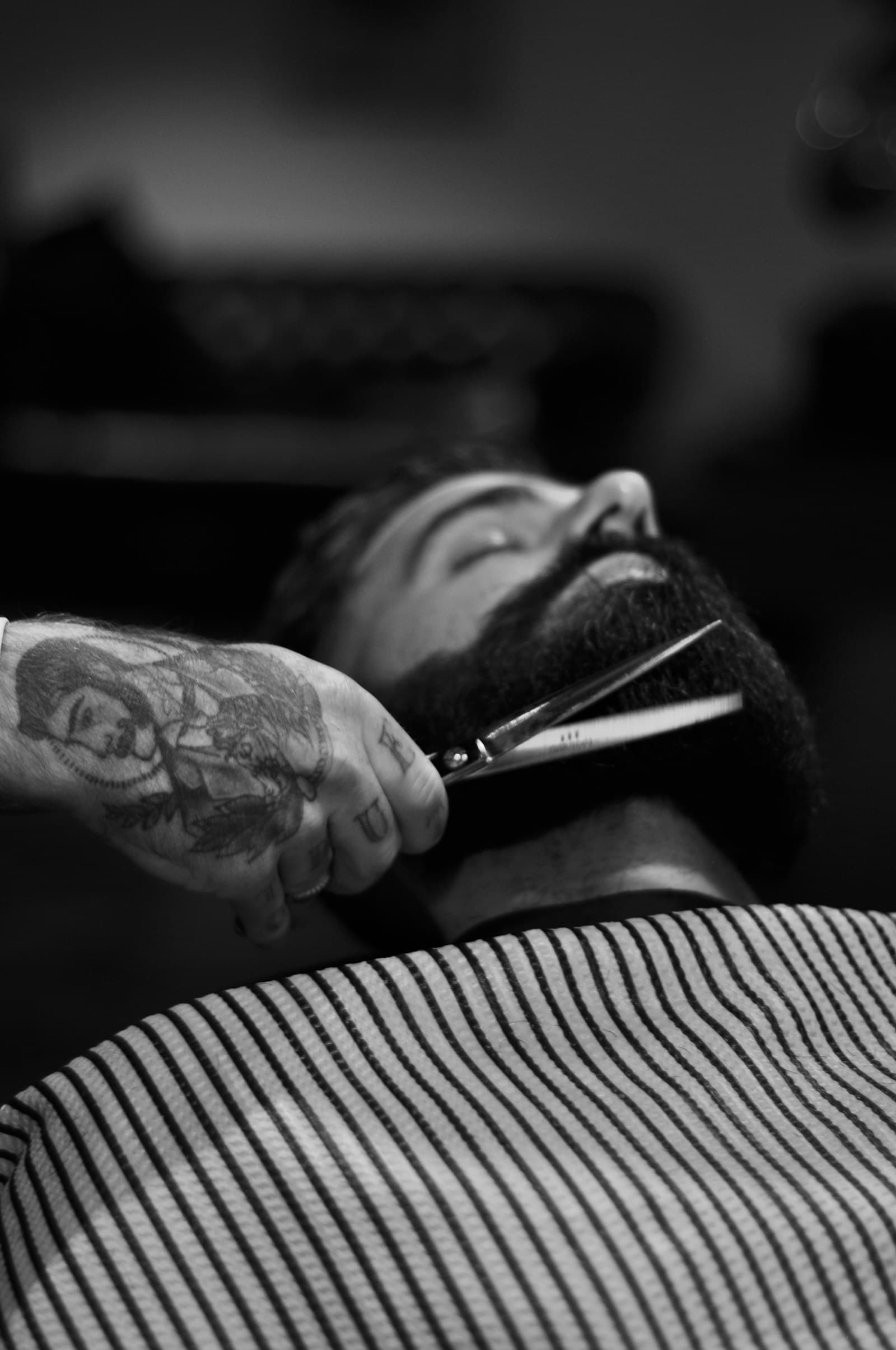 Close-up of scissors trimming a beard